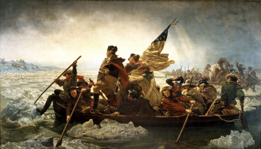 George Washington standing in a boat as soldiers cross the icy Delaware River in 1776.