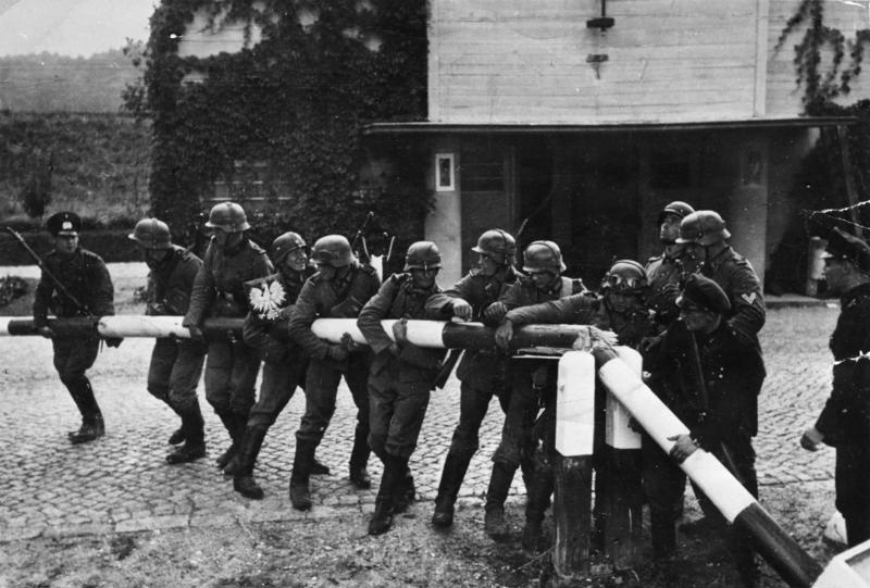 Dominoes falling in sequence showing chain reaction of events leading to WWII.