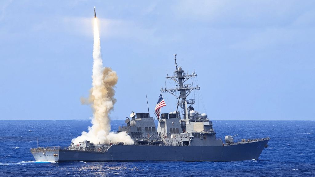 US Navy Arleigh Burke destroyer launching missiles from vertical launch system VLS cells